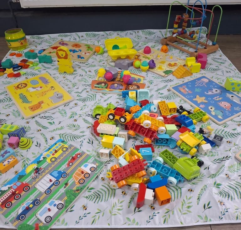 Selection-of-toys-on-play-mat-at-swtfc-baby-and-toddler-group-saffron-Walden
