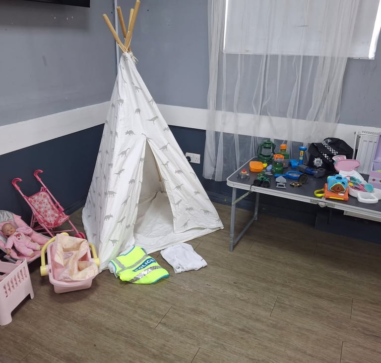 Dolly and dress up corner with teepee and role play toys at SWTFC baby and toddler group