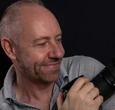 Jon Fallon wedding photographer holding a camera