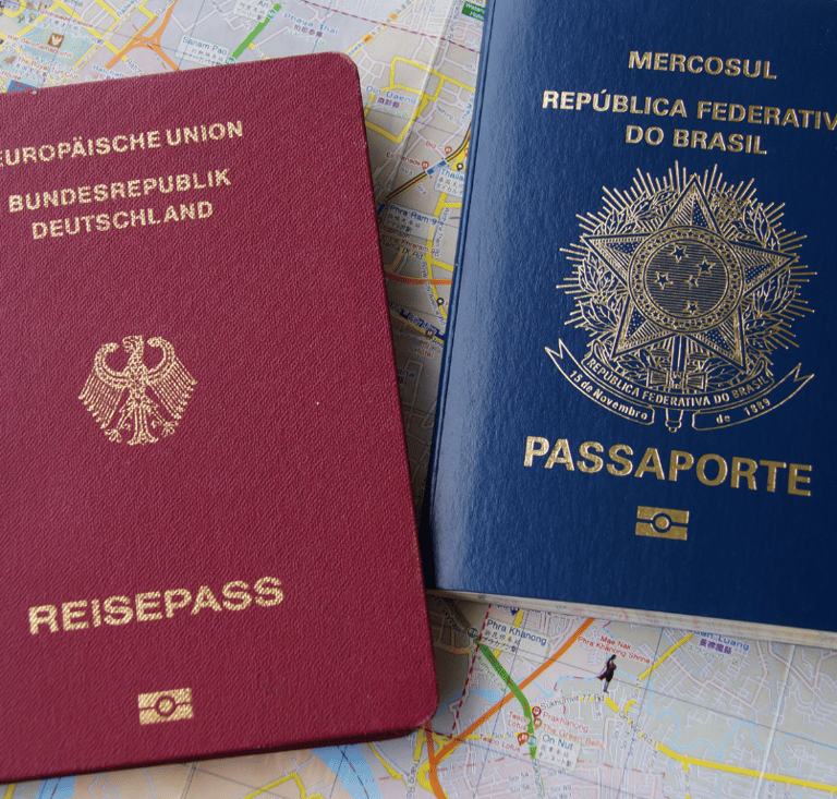 two passports are sitting on a map of a map of the world