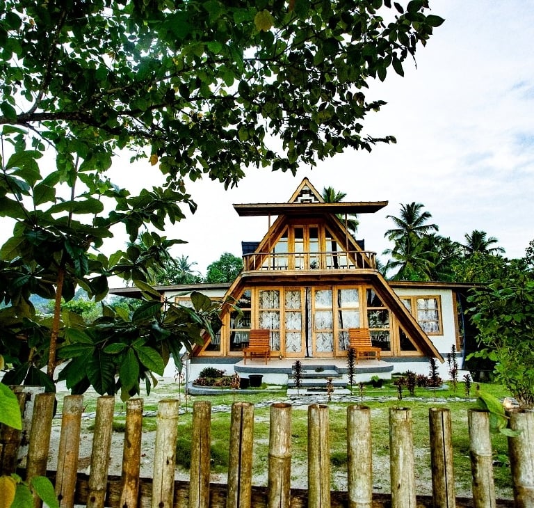 a house with a wooden fence and a wooden fence