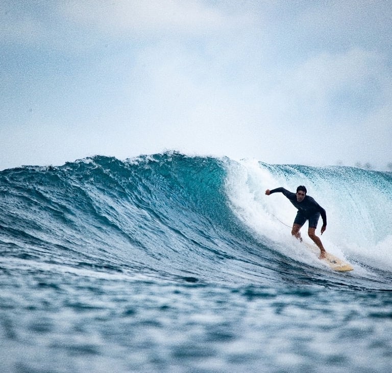 a man enjoying his wave in Mentawai 