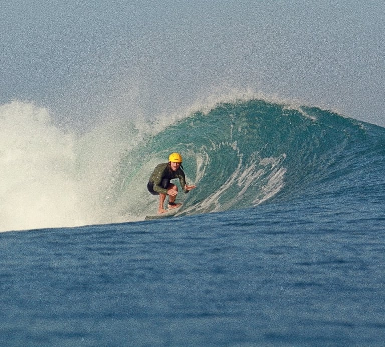 a surfer is riding a wave in the ocean