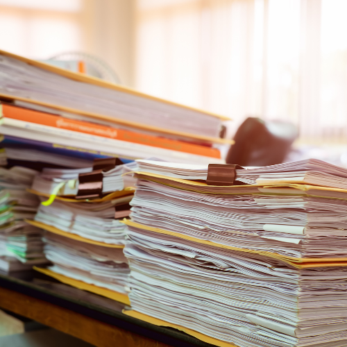 A tall stack of paperwork