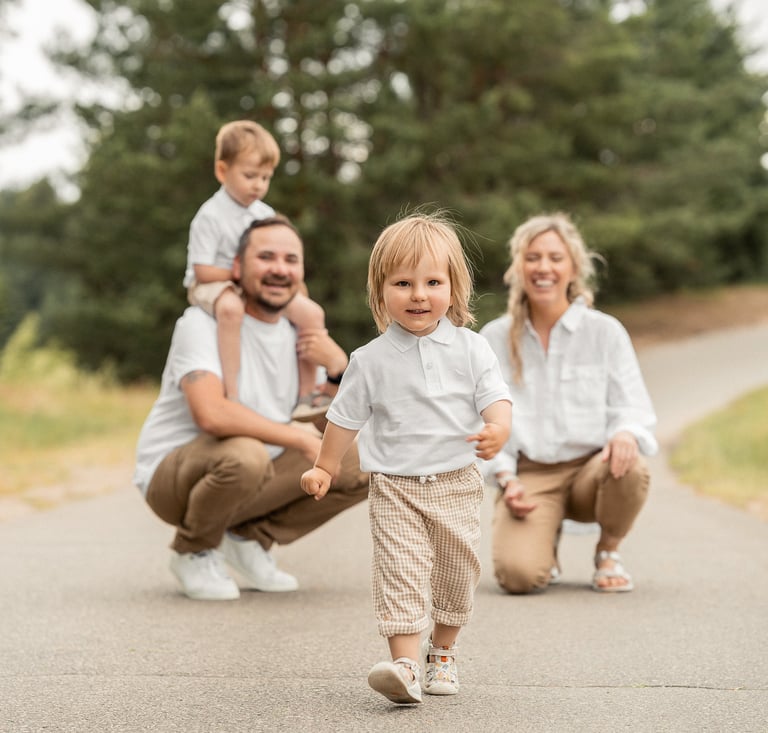 a family of three children walking down a path