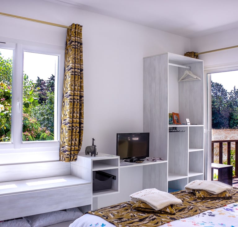 Bed with full bedding, floating bed with swimming pool view, olive grove view and garden at Domaine Des Lucques