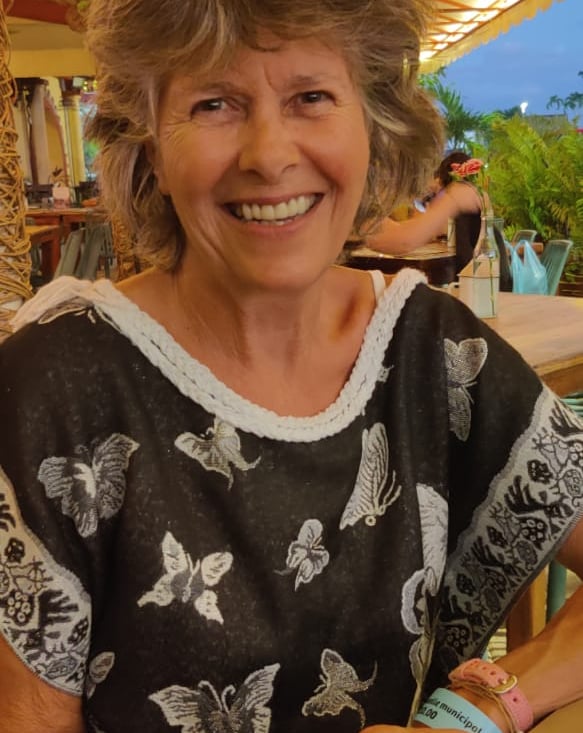 Sara Verrall smiling in Black and White butterfly dress