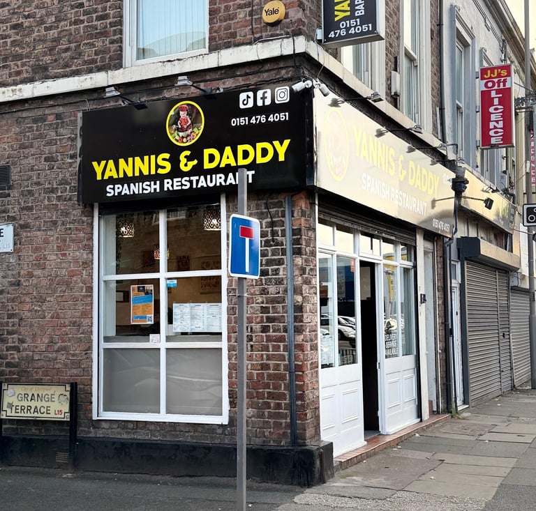 a Spanish restaurant situate on Grange Terrance with a sign that says Yannis & Daddy