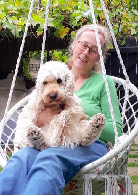 Tracy with Penny, swinging in a chair, Risca, Newport, South Wales, UK.