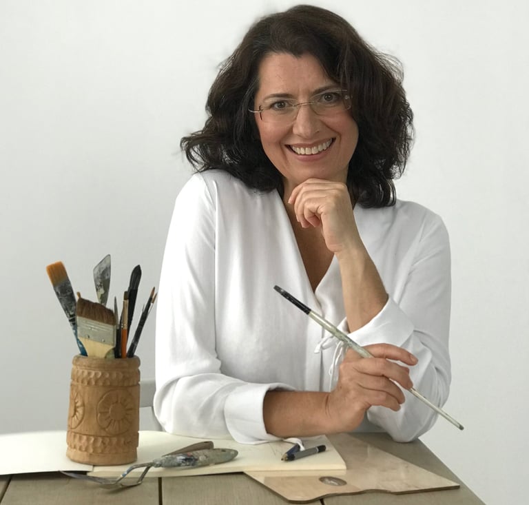 Mag Wilk  sitting at a table with a pencil and pencils