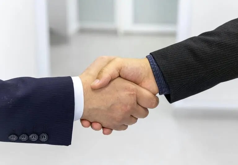 Handshake between professionals symbolizing trust, partnership, and business collaboration
