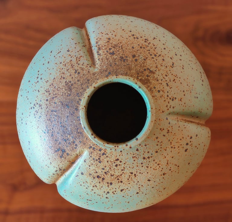 wheel-thrown and altered vase, spray-glazed with a base coat of green and top coat of earthy brown
