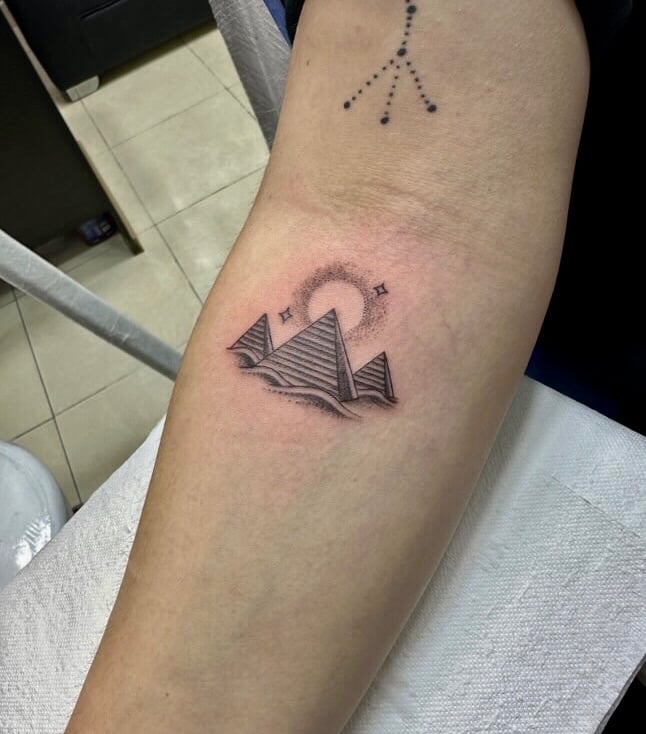 Sun and moon tattoo in fine line on forearm — Hurghada Tattoo Studio