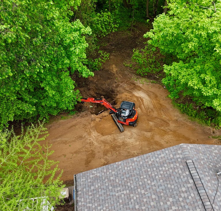 Kubota excavator digging dirt