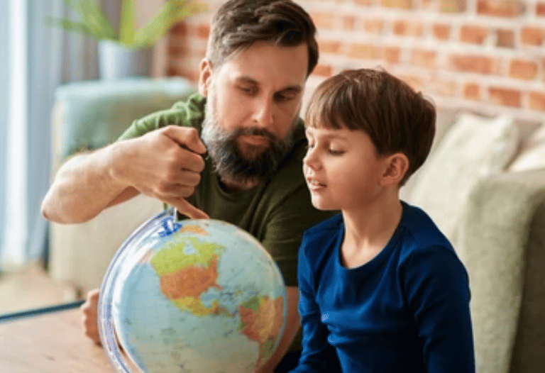 parent showing earth globe to kid