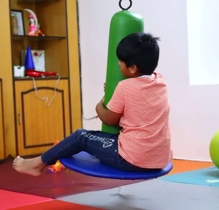 Kid undergoing Occupational Therapy for sensory balancing