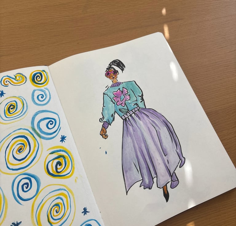 a book opened to show a drawing of a woman in a dress