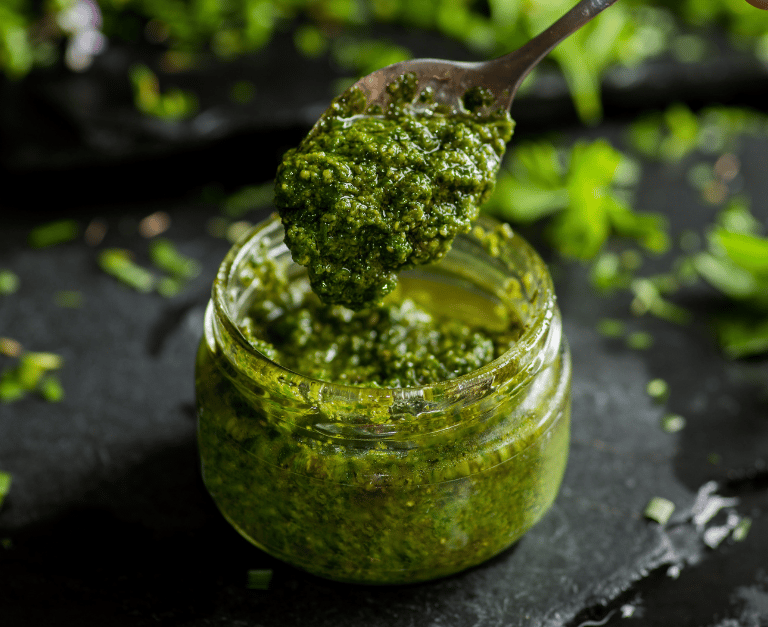 Jar of spinach basil pesto make with Thrive Freeze Dried Spinach