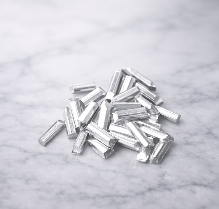 Pure silver grain pieces on light marble, showing texture for DIY jewelry making 10 gram