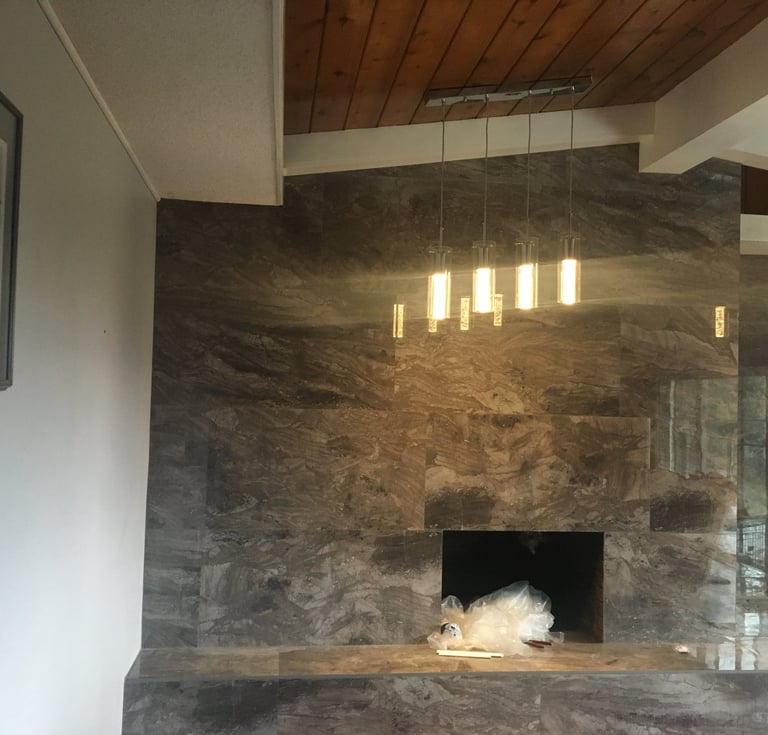 large format tile over brick fireplace