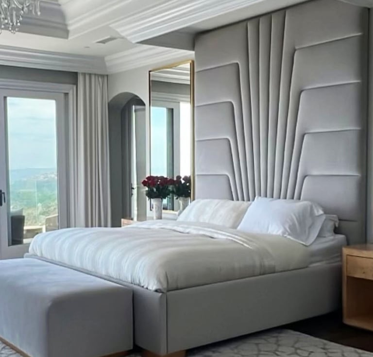 Tall sculpted headboard bed in light gray fabric, custom-designed by Solo Home Decor for luxury interiors.