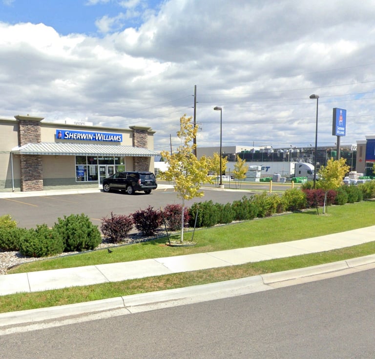 a car dealership with a truck parked in front of it