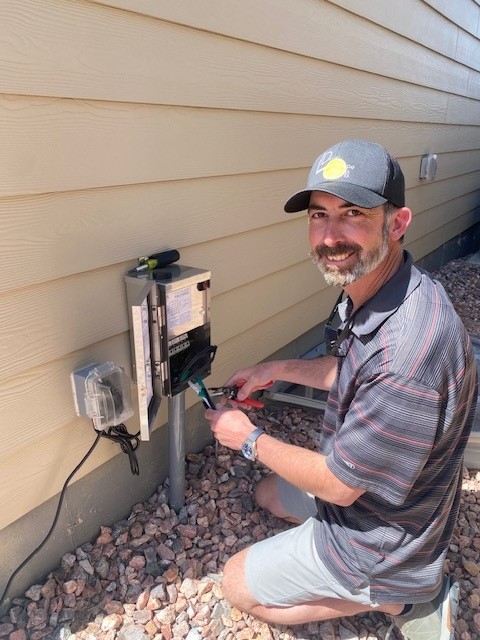 technician fixing a transformer in Peyton Colorado