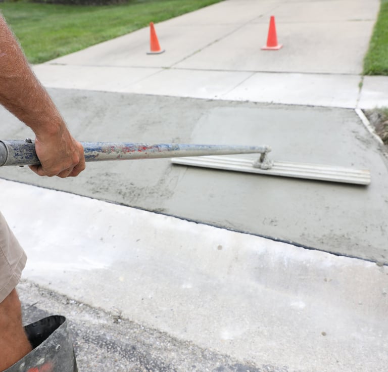 Concrete driveway installation process St Petersburg FL finishing and leveling surface