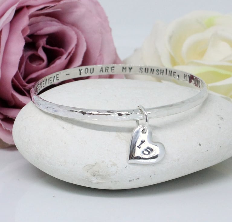 Handcrafted silver jewellery personalised with an age and message for milestone birthdays