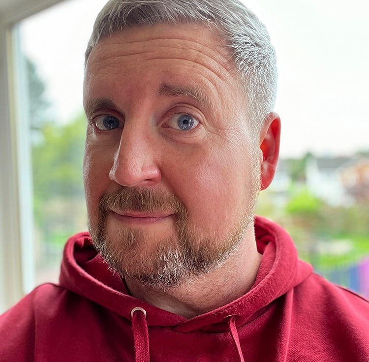 Mike Brown founder of Lobotype, wearing a polo and looking nervously at the camera.