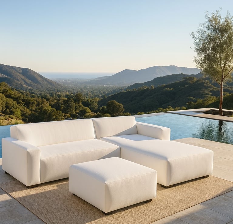 Modern white sectional sofa by Solo Home Decor in a luxurious mountain backyard with an infinity pool and ocean view.