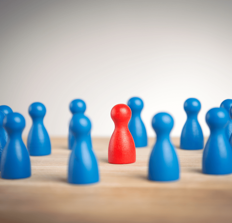 a single red pawn surrounded by blue pawns