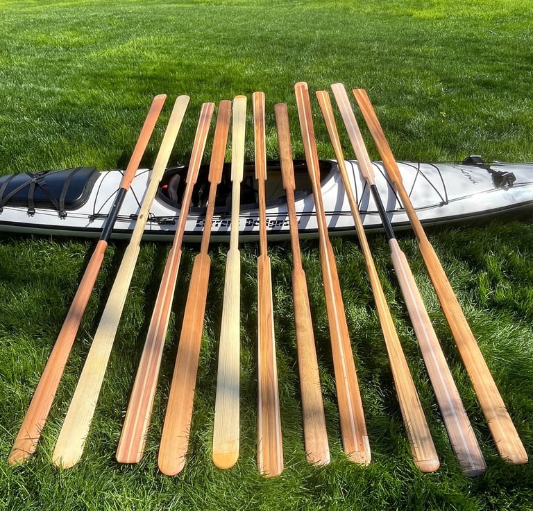 Assortment of wooden Greenland paddles