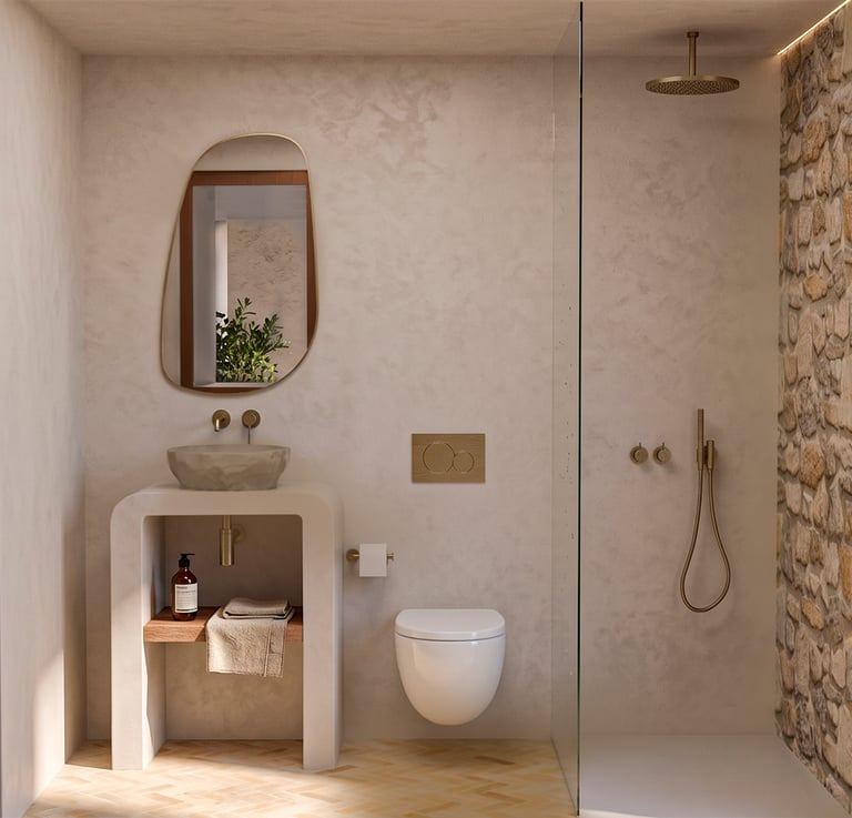 Modern rustic bathroom featuring a stone vessel sink, gold fixtures, and a walk-in shower with stone walls.