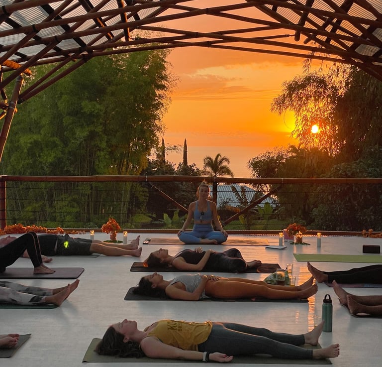 a group of people doing yoga in a large open space
