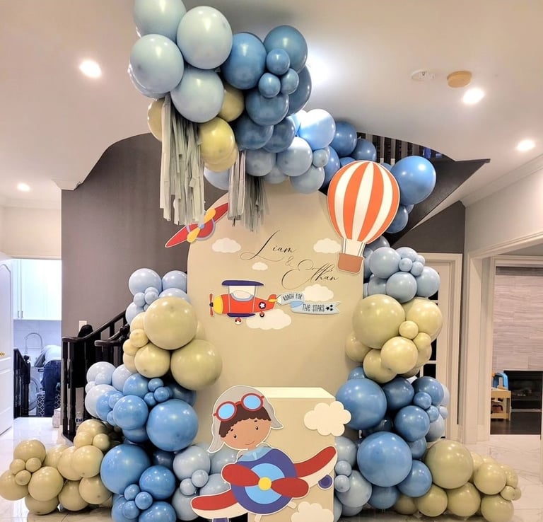Airplane themed balloon backdrop for two brothers