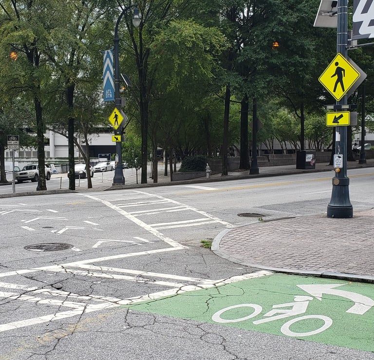 Two-stage bicycle turn queue box and crosswalk with RRFB