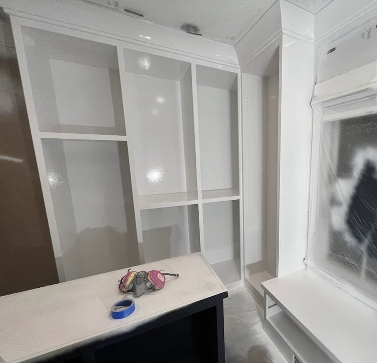 Custom refinished white built-in closet with a smooth, professional finish, enhancing storage space