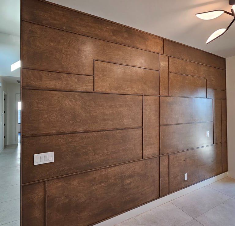 Modern accent wall with medium-tone wood trim, adding warmth and texture to a contemporary interior