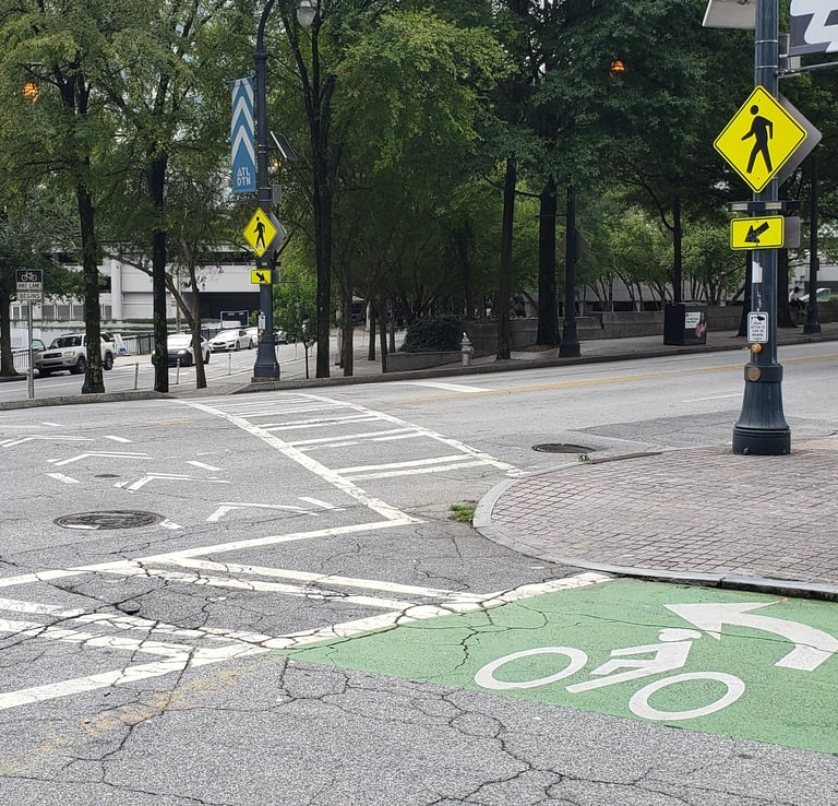 Two-stage bicycle turn queue box with crosswalk and RRFB