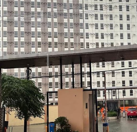 a city street scene with a car parked in front of a building