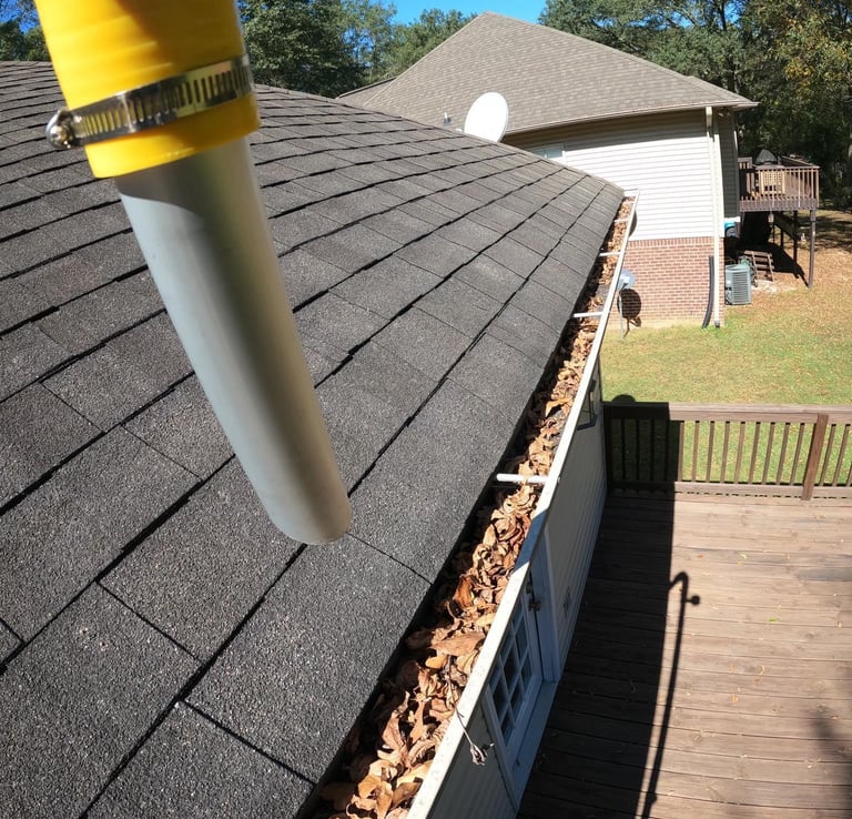 Residential gutter cleaning with a gutter vac