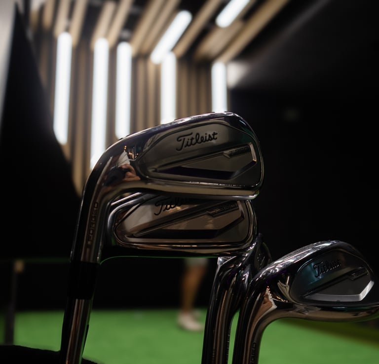 Titleist golf clubs in 1IRON indoor golf simulator venue