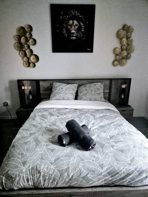 a bed with a towel on top of it