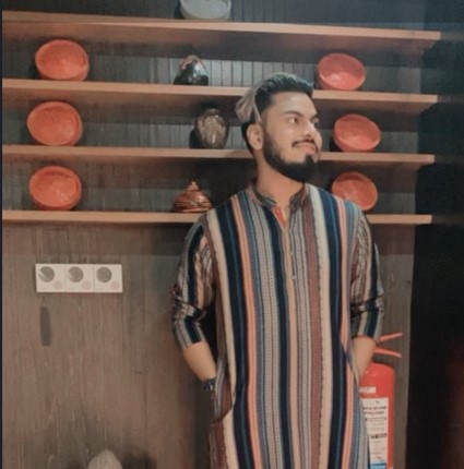 a man in a striped shirt and a red and white striped shirt