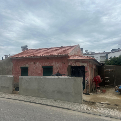 a house with a red roof and a red roof
