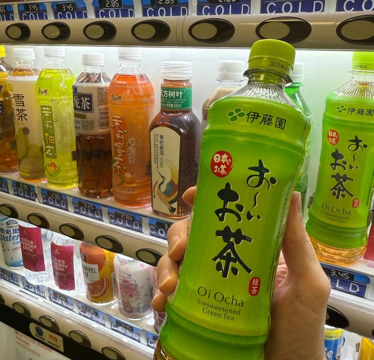 a person holding a bottle of green tea
