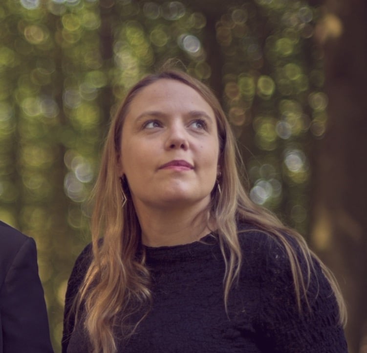 a man and woman standing next to each other