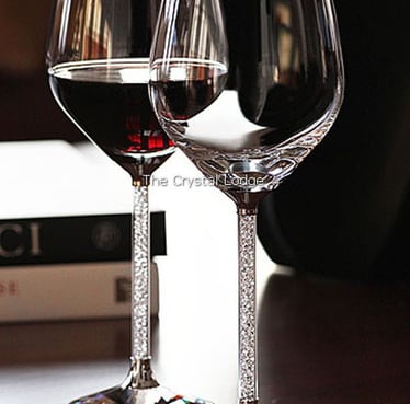 Crystalline red wine glasses with Swarovski-style embellished stems, premium luxury glassware.