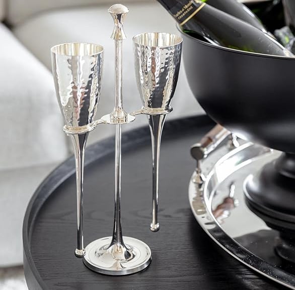Silver champagne flutes with crystal-inspired stems, elegant luxury glassware.
